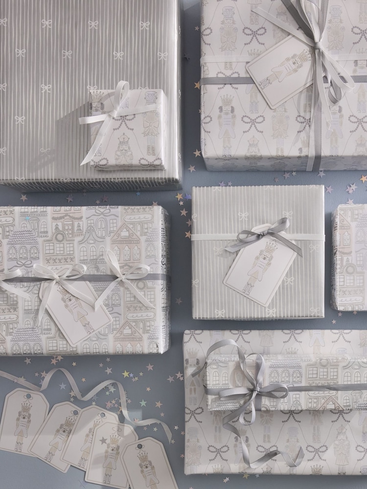Set of 3 Silver Nutcracker Christmas Wrapping Paper Set of 3, 3m Gift Tags and Ribbons Set - Image 1 of 4 Set of 3 Silver Nutcracker Christmas Wrapping Paper Set of 3, 3m Gift Tags and Ribbons Set - Image 1 of 4