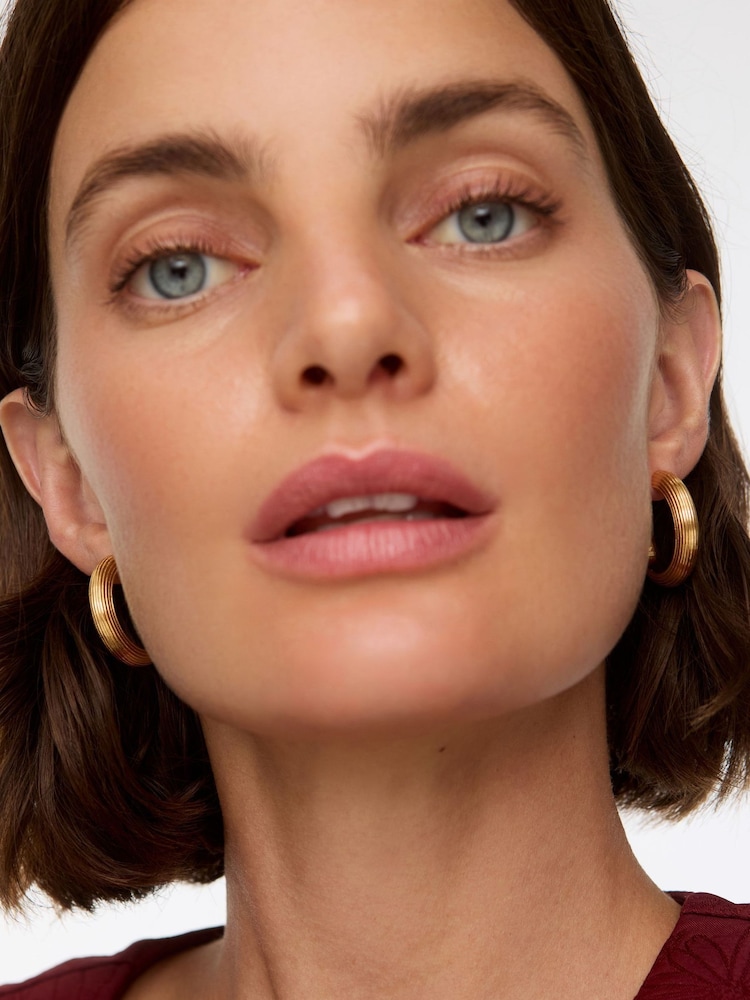 Oliver Bonas Gold Tone Stainless Steel Waterproof Line Chunky Hoop Earrings - Image 5 of 5 Oliver Bonas Gold Tone Stainless Steel Waterproof Line Chunky Hoop Earrings - Image 5 of 5