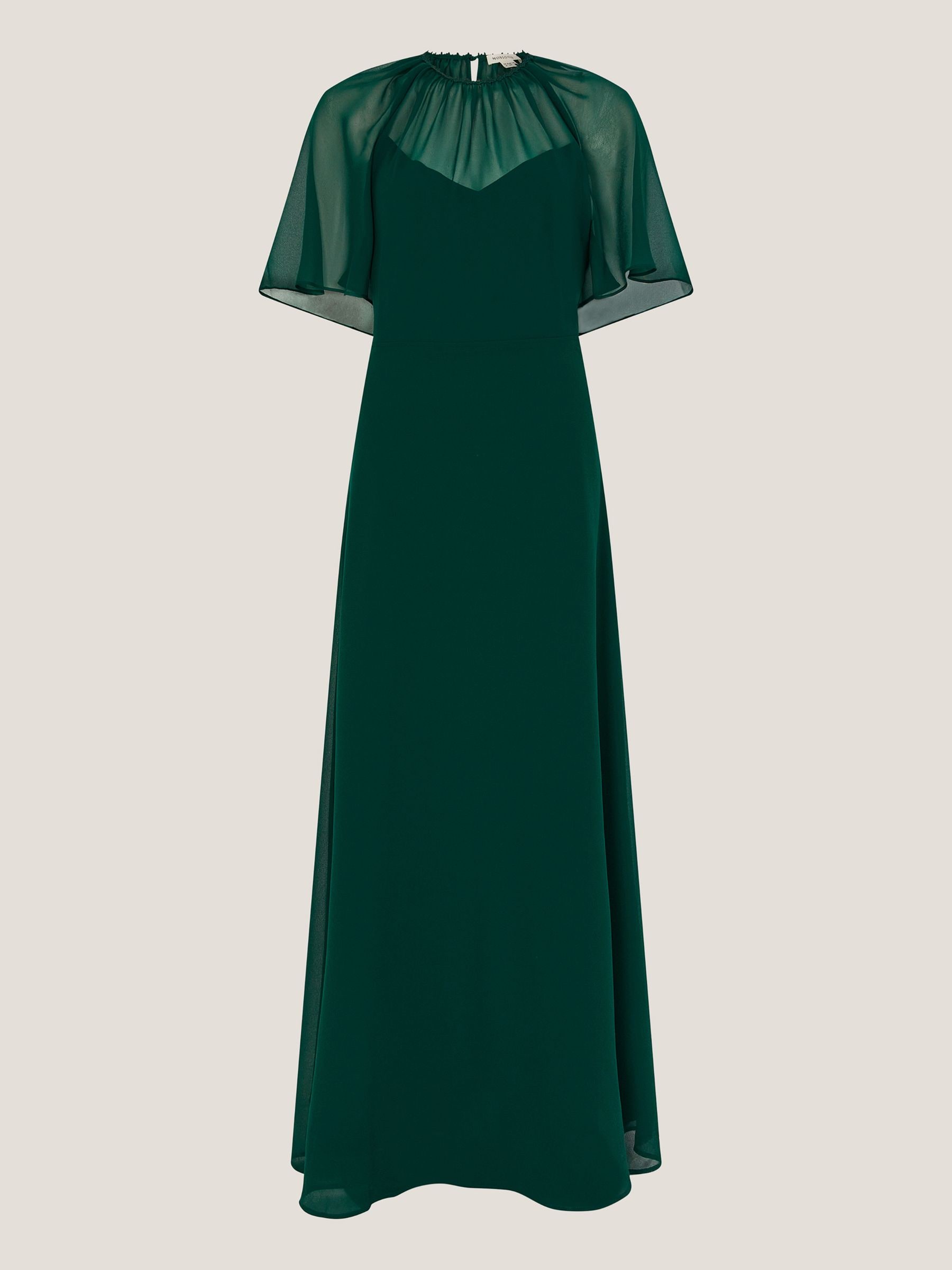 emerald green dress with sheer sleeves Emerald elegance with a modern twist This stunning off-shoulder dress blends timeless grace with contemporary charm. The rich green hue, sheer detailing, and flowing silhouette create a look that's effortlessly classy