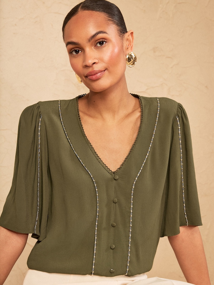 Love & Roses Khaki Green Beaded Trim V-Neck Blouse - Image 1 of 4