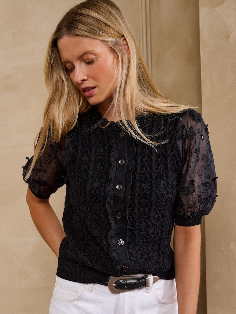 Love & Roses Black Broderie Woven Sleeve Cotton Rich Knitted Top - Image 1 of 5 Love & Roses Black Broderie Woven Sleeve Cotton Rich Knitted Top - Image 1 of 5