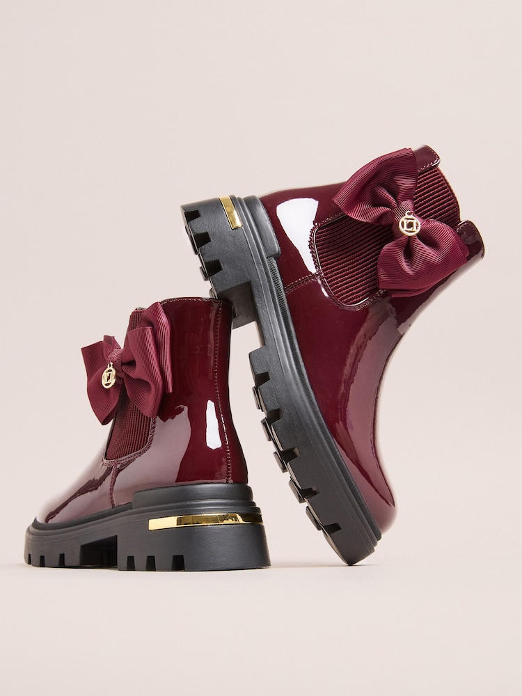 Lipsy Burgundy Red Black Patent Faux Leather Bow Elasticated Heel Clip Ankle Chelsea Boots - Image 1 of 5 Lipsy Burgundy Red Black Patent Faux Leather Bow Elasticated Heel Clip Ankle Chelsea Boots - Image 1 of 5