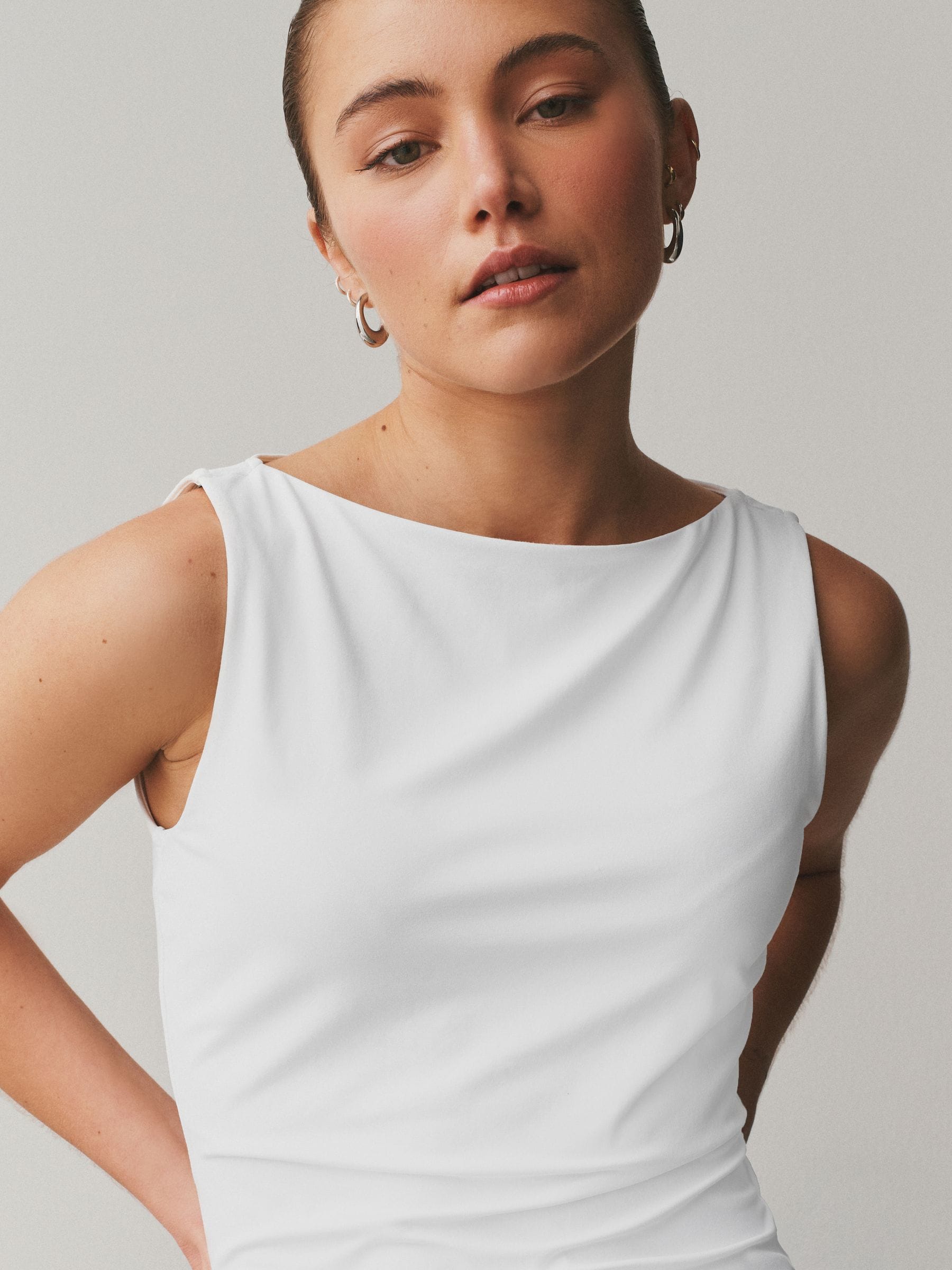 Buy White Soft Touch Slinky Boat Neck Sleeveless Top from the Next