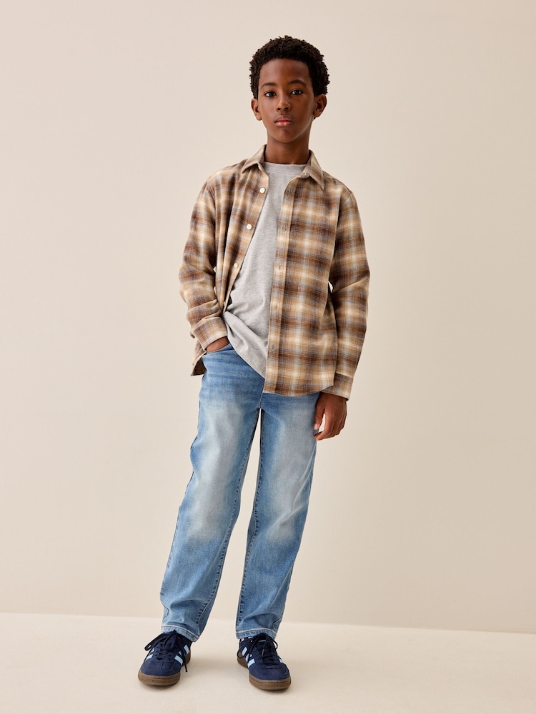 Light Blue Loose Fit Stretch Elasticated Waist Jeans (3-16yrs) - Image 1 of 4 Light Blue Loose Fit Stretch Elasticated Waist Jeans (3-16yrs) - Image 1 of 4