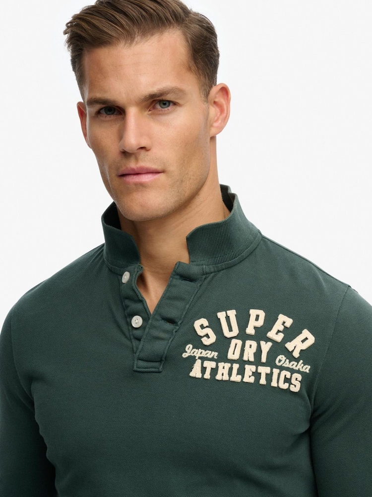 ירוק - Superdry חולצת פולו ספורטיבית במראה וינטג' עם שרוולים ארוכים - תמונה 5 מתוך 5 ירוק - Superdry חולצת פולו ספורטיבית במראה וינטג' עם שרוולים ארוכים - תמונה 5 מתוך 5