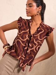 Friends Like These Red Swirl Print Sleeveless Tie Neck Blouse - Image 1 of 5