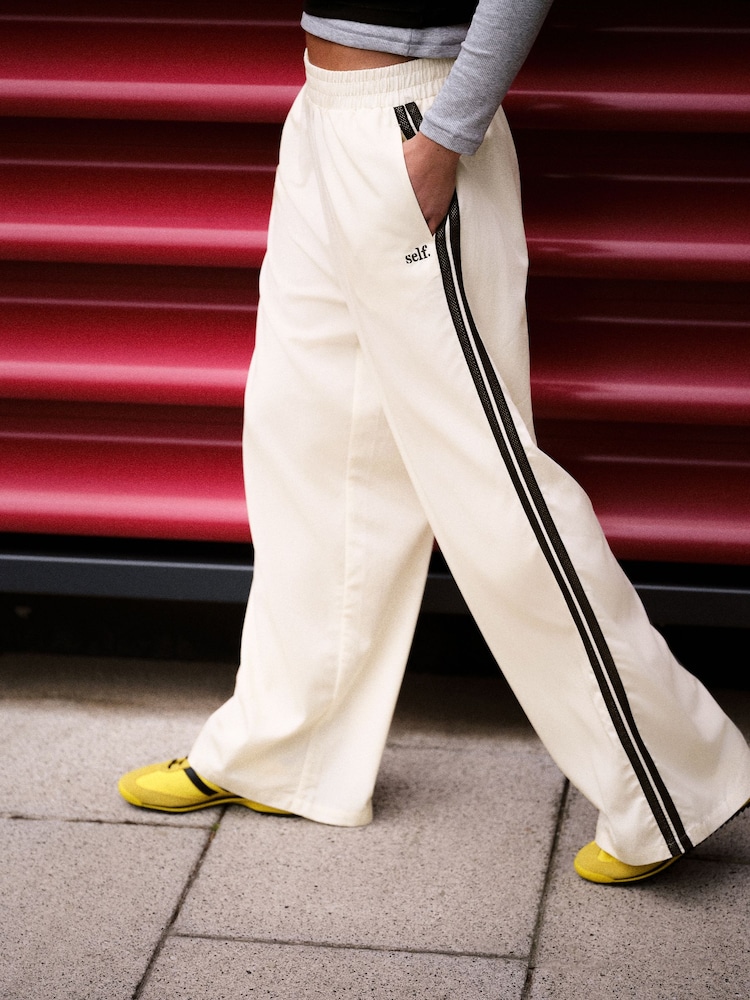 self. Ecru Wide Leg Viscose Blend Track Trousers With Side Stripe - Image 1 of 9