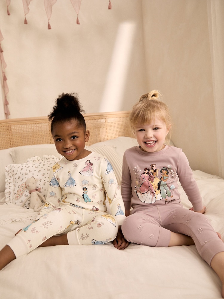 Pink/Cream Disney Princess Snuggle Pyjamas 2 Pack (9mths-12yrs) - Image 1 of 4 Pink/Cream Disney Princess Snuggle Pyjamas 2 Pack (9mths-12yrs) - Image 1 of 4