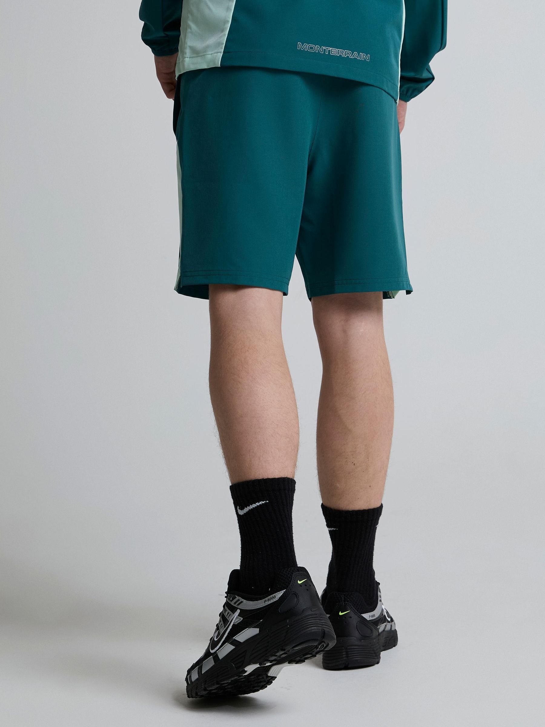 Buy Monterrain Green Junior Deflect Woven Shorts from the Next UK ...