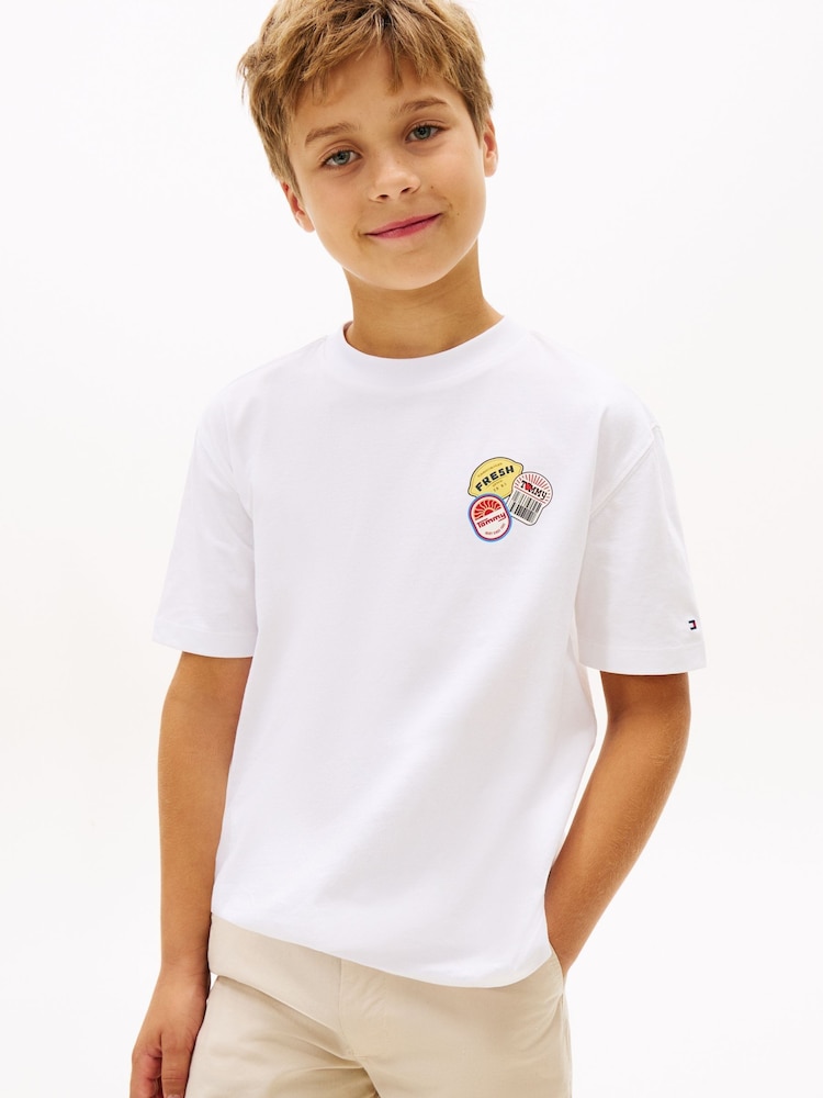 أبيض - Tommy Hilfiger Sticker Print Back Graphic Jersey T-Shirt - Image 1 of 5 أبيض - Tommy Hilfiger Sticker Print Back Graphic Jersey T-Shirt - Image 1 of 5