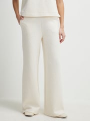 بنطلون رياضي جاكار برِجل واسعة بخصر قابل للتمدد من River Island - صورة 1 من 4