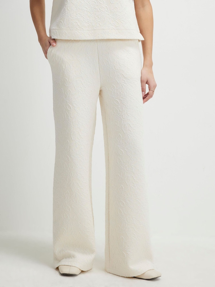 بنطلون رياضي جاكار برِجل واسعة بخصر قابل للتمدد من River Island - صورة 1 من 4