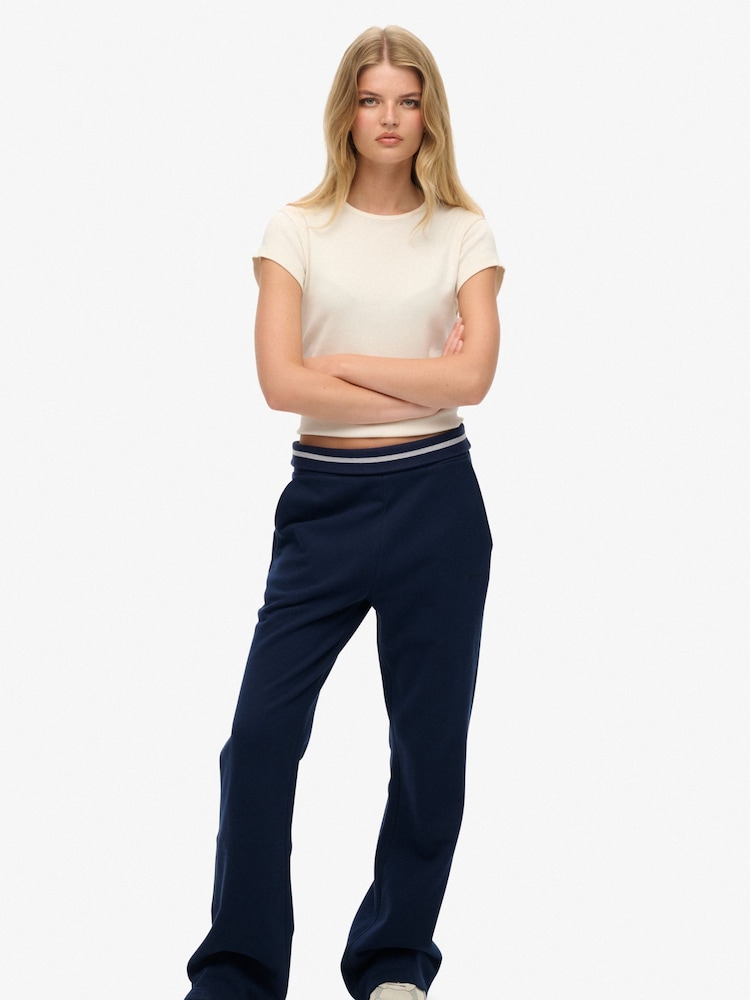 Superdry Dark Blue Athletic Essentials Logo Low Rise Flare Joggers - Image 1 of 6 Superdry Dark Blue Athletic Essentials Logo Low Rise Flare Joggers - Image 1 of 6