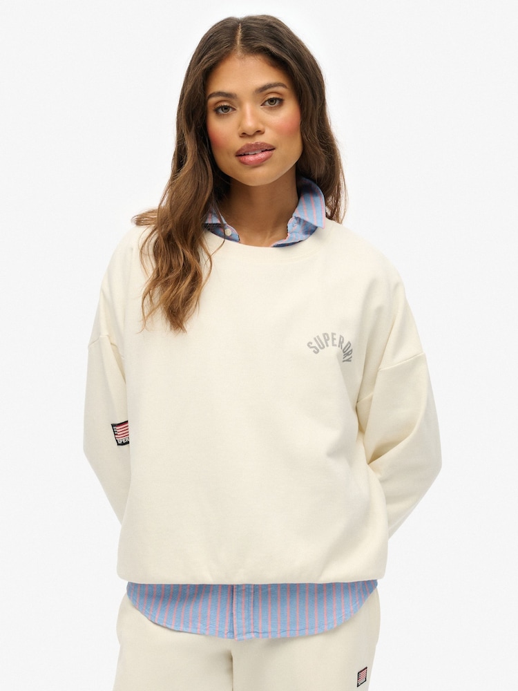Superdry Cream Athletic Essentials Printed Crew Sweatshirt - Image 1 of 5 Superdry Cream Athletic Essentials Printed Crew Sweatshirt - Image 1 of 5