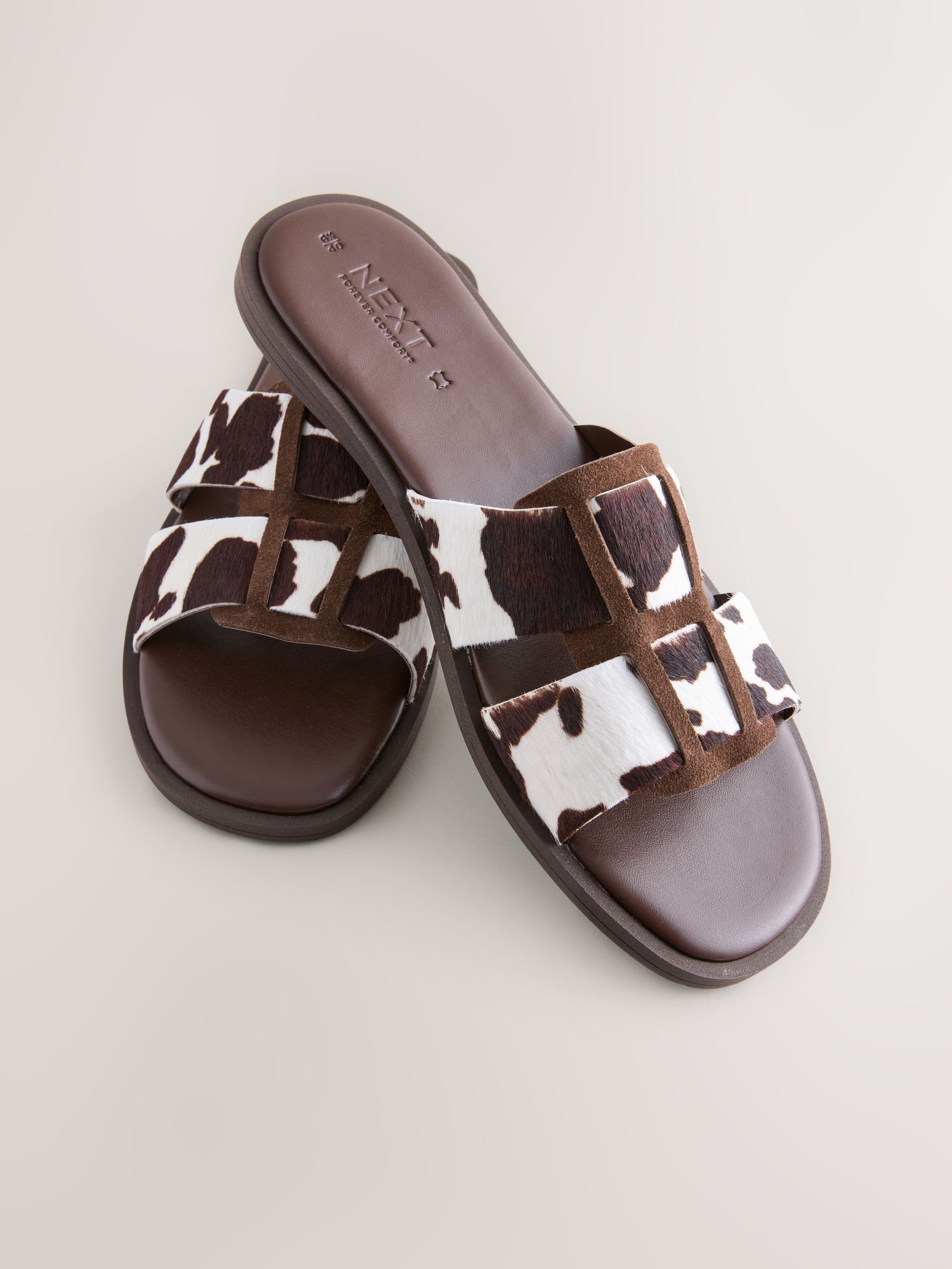 Buy Cow Print Leather Standard/Wide Fit Slot Mule Sandals from