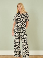 Yumi Black Relaxed Fit 100% Cotton Splash Print Trousers - Image 1 of 5