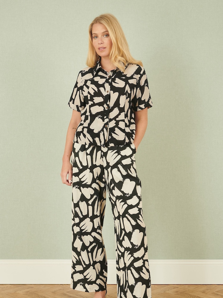 Yumi Black Relaxed Fit 100% Cotton Splash Print Trousers - Image 1 of 5