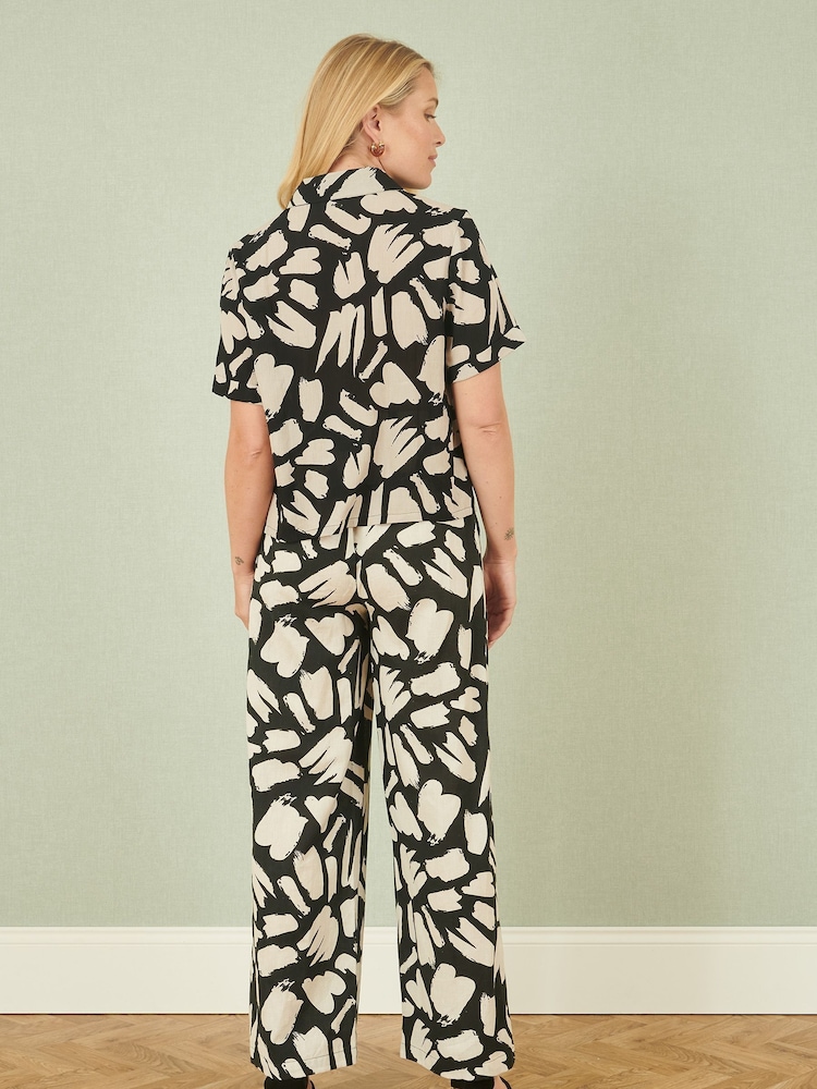 Yumi Black Relaxed Fit 100% Cotton Splash Print Trousers - Image 4 of 5
