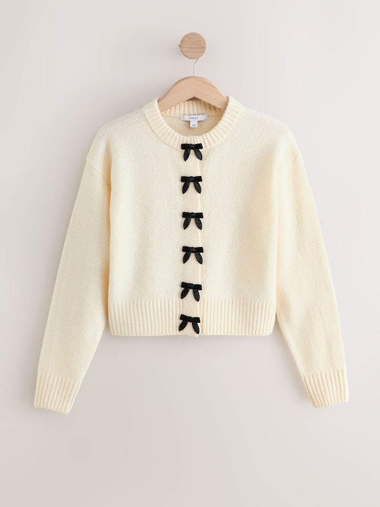 Ecru Bows Crew Neck Knitted Cardigan - Image 1 of 3 Ecru Bows Crew Neck Knitted Cardigan - Image 1 of 3