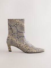 Snake Forever Comfort® Chisel Toe Heeled Ankle Boots - Image 1 of 5