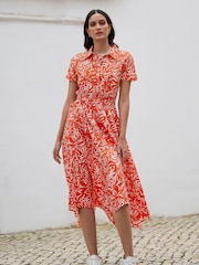 Yumi Orange Leaf Print Dip Hem Midi Shirt Dress - Image 1 of 5