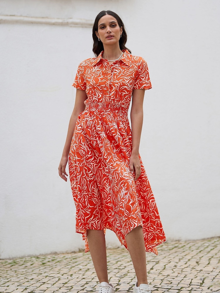 Yumi Orange Leaf Print Dip Hem Midi Shirt Dress - Image 1 of 5