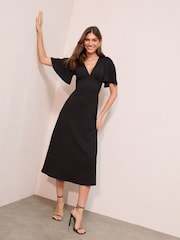 Friends Like These Black Textured Jersey V-Neck Midi Dress - Image 1 of 4