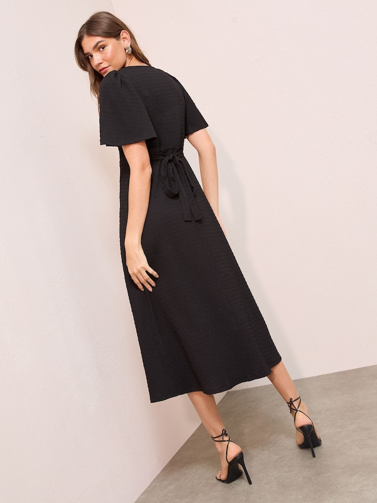 Friends Like These Black Textured Jersey V-Neck Midi Dress - Image 4 of 4