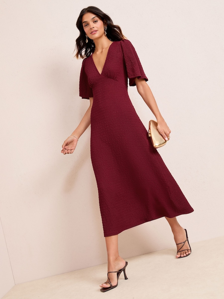Friends Like These Burgundy Red Textured Jersey V-Neck Midi Dress - Image 1 of 4