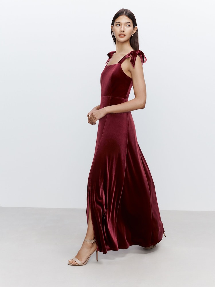 Burgundy Red Bridesmaid Bow Shoulder Velvet Maxi Dress - Image 1 of 9 Burgundy Red Bridesmaid Bow Shoulder Velvet Maxi Dress - Image 1 of 9