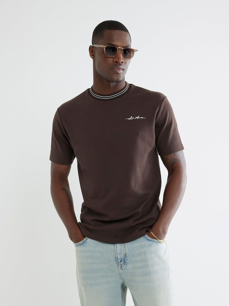 River Island Brown Slim Fit Les Amis Ringer 100% Cotton T-Shirt - Image 1 of 4 River Island Brown Slim Fit Les Amis Ringer 100% Cotton T-Shirt - Image 1 of 4