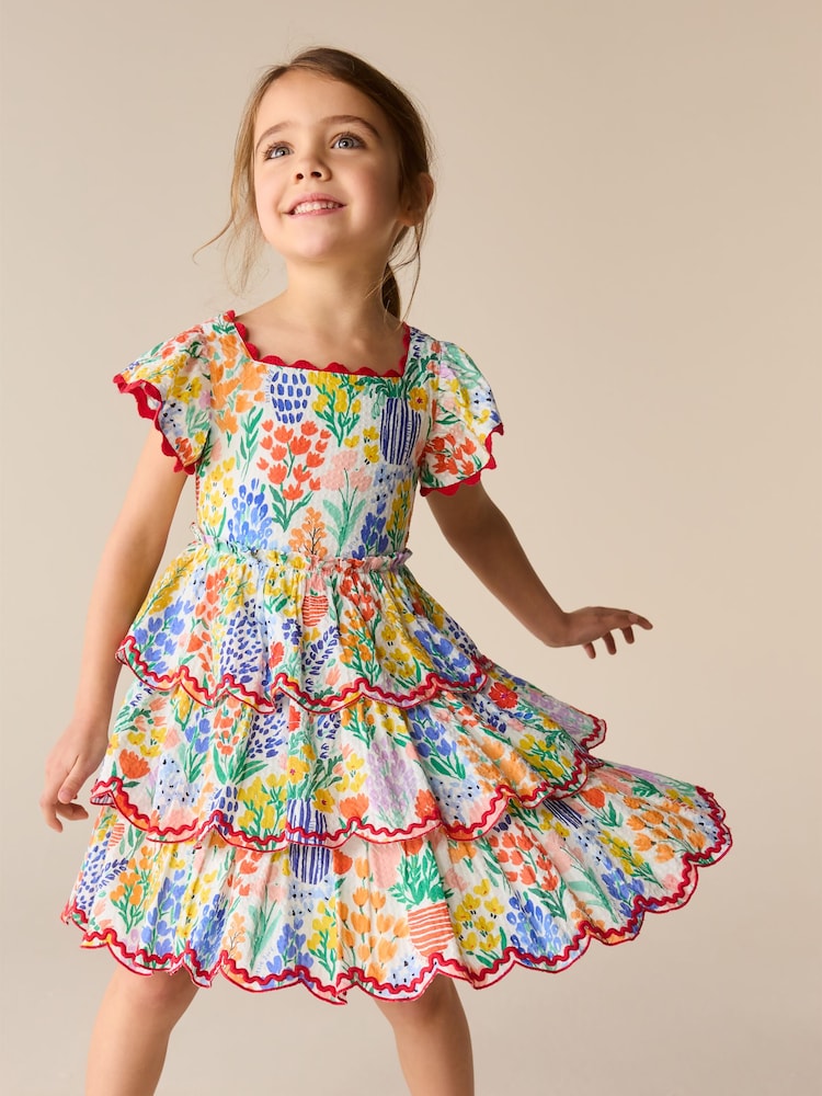 Little Bird by Jools Oliver Floral Print Tiered Bow Back Frill Sleeve Dress - Image 1 of 11 Little Bird by Jools Oliver Floral Print Tiered Bow Back Frill Sleeve Dress - Image 1 of 11
