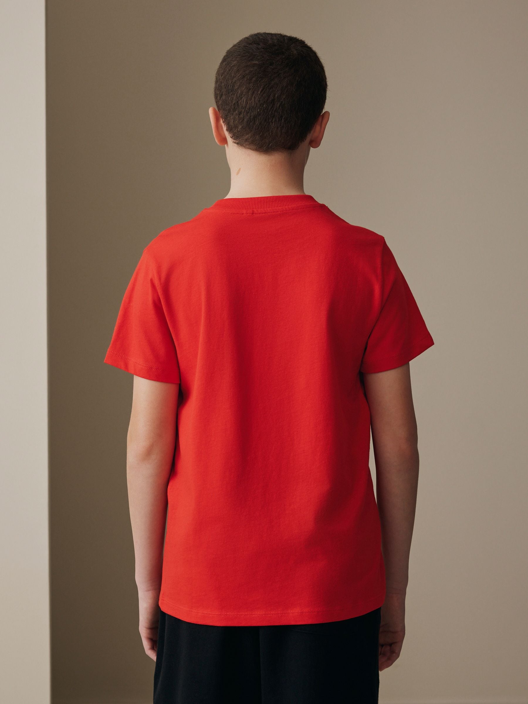 Buy Red Short Sleeve Graphic Football T-Shirt (3-16yrs) from the