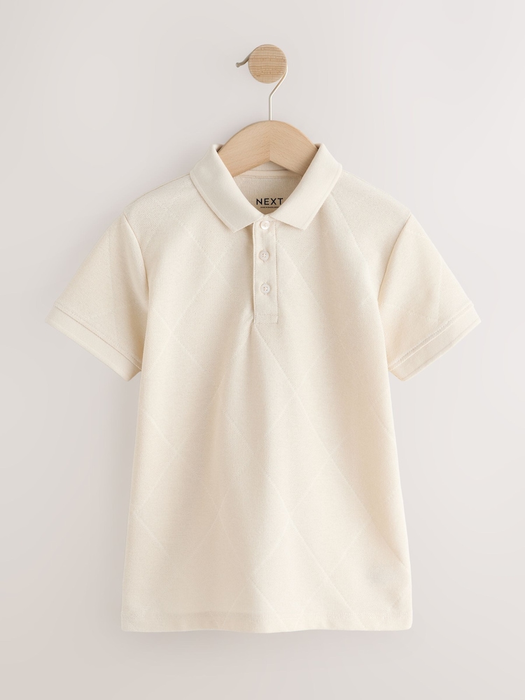 كريم - Short Sleeve Jersey Polo Shirt (3-16yrs) - صورة 1 من 4 كريم - Short Sleeve Jersey Polo Shirt (3-16yrs) - صورة 1 من 4