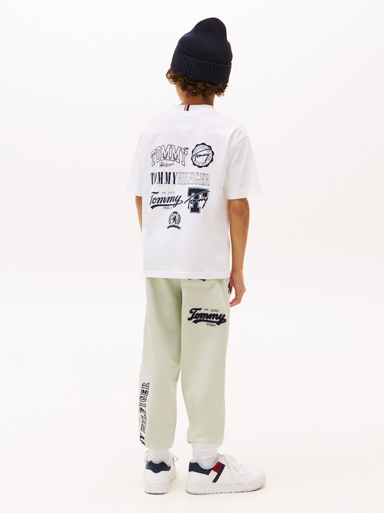 Tommy Hilfiger White Varsity Back Graphic T-Shirt - Image 1 of 5 Tommy Hilfiger White Varsity Back Graphic T-Shirt - Image 1 of 5