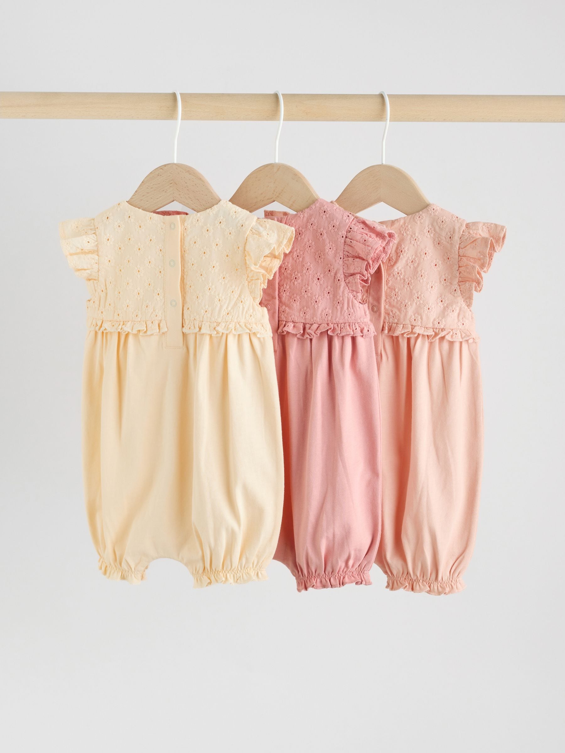 Buy Tonal Pink Broderie 3 Pack Baby Rompers from Next USA