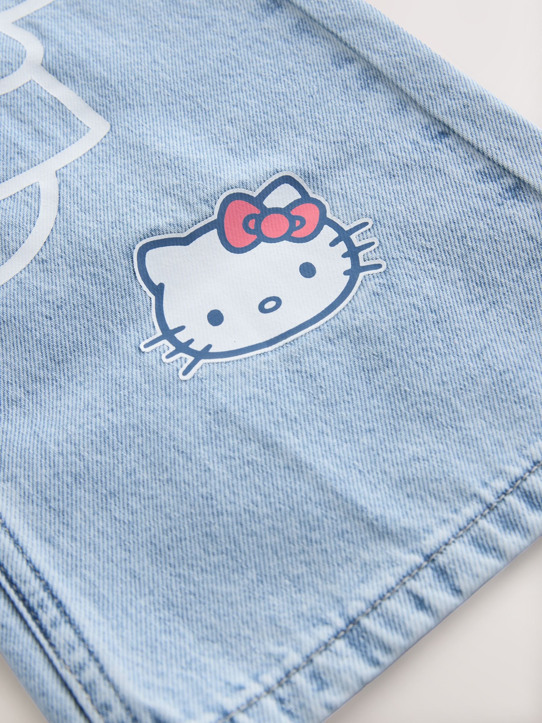 Comprar Lavagem intermediária - Calça jeans Hello Kitty de perna