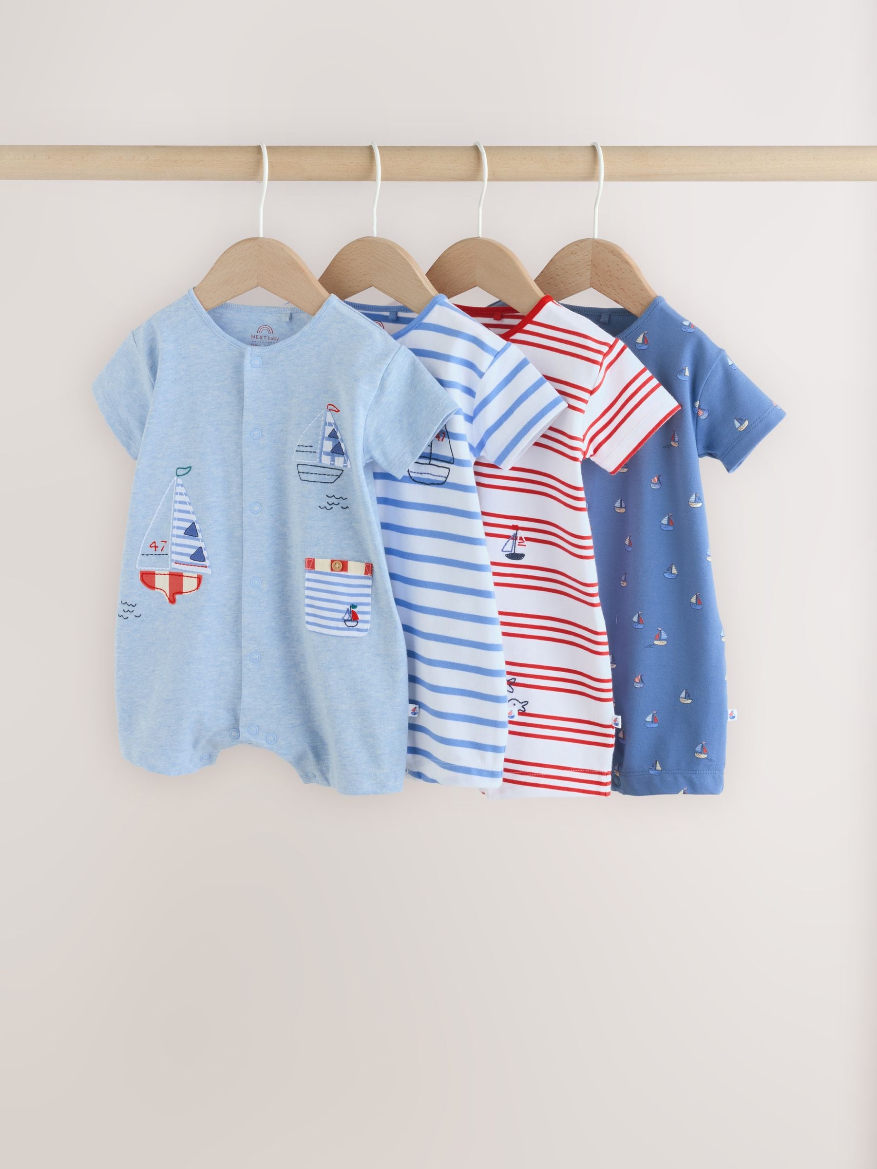 Buy Blue Nautical Jersey Baby Rompers 4 Pack from the Next UK