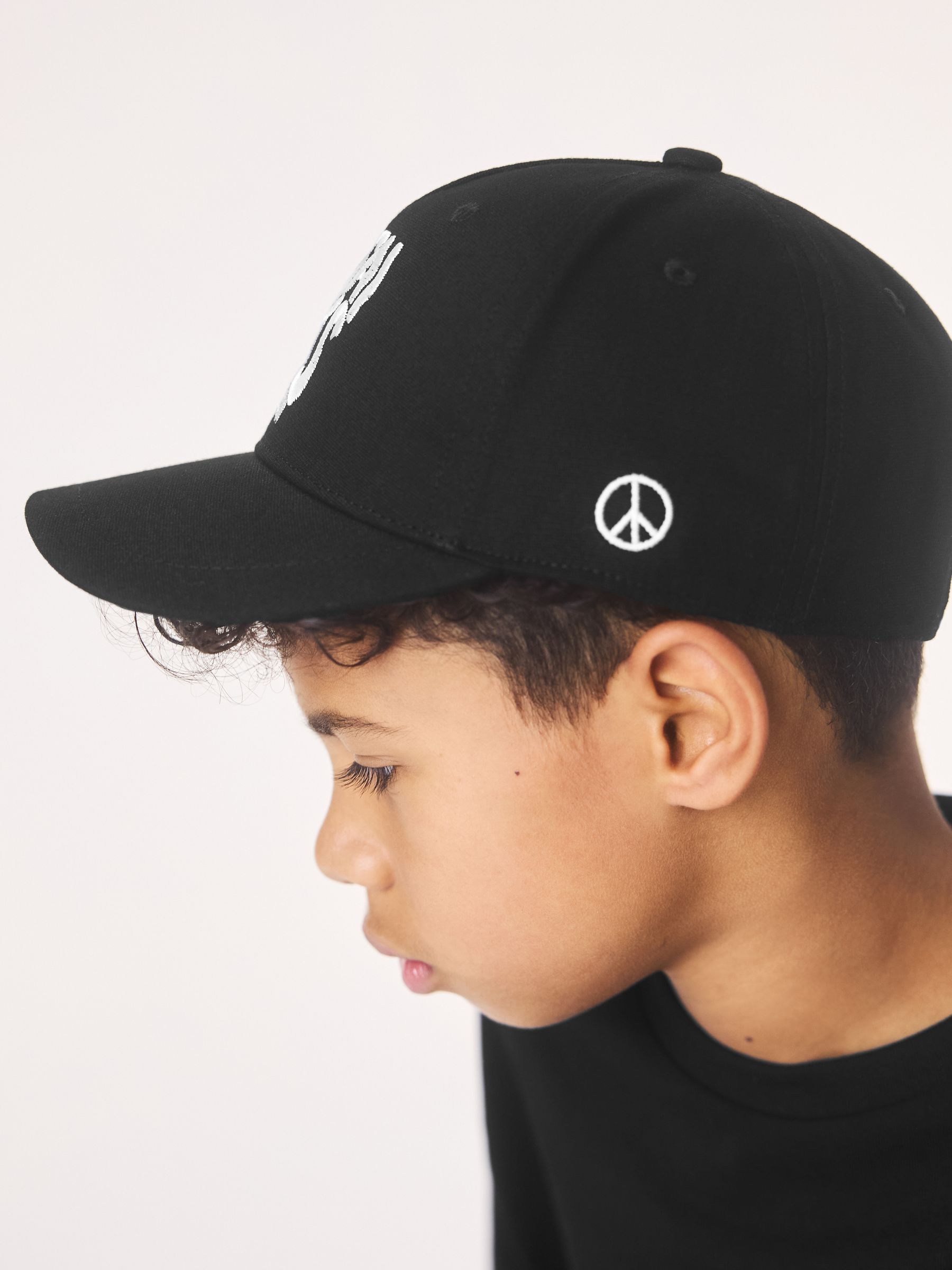Buy smALLSAINTS Black Logo Baseball Cap from the Next UK online shop