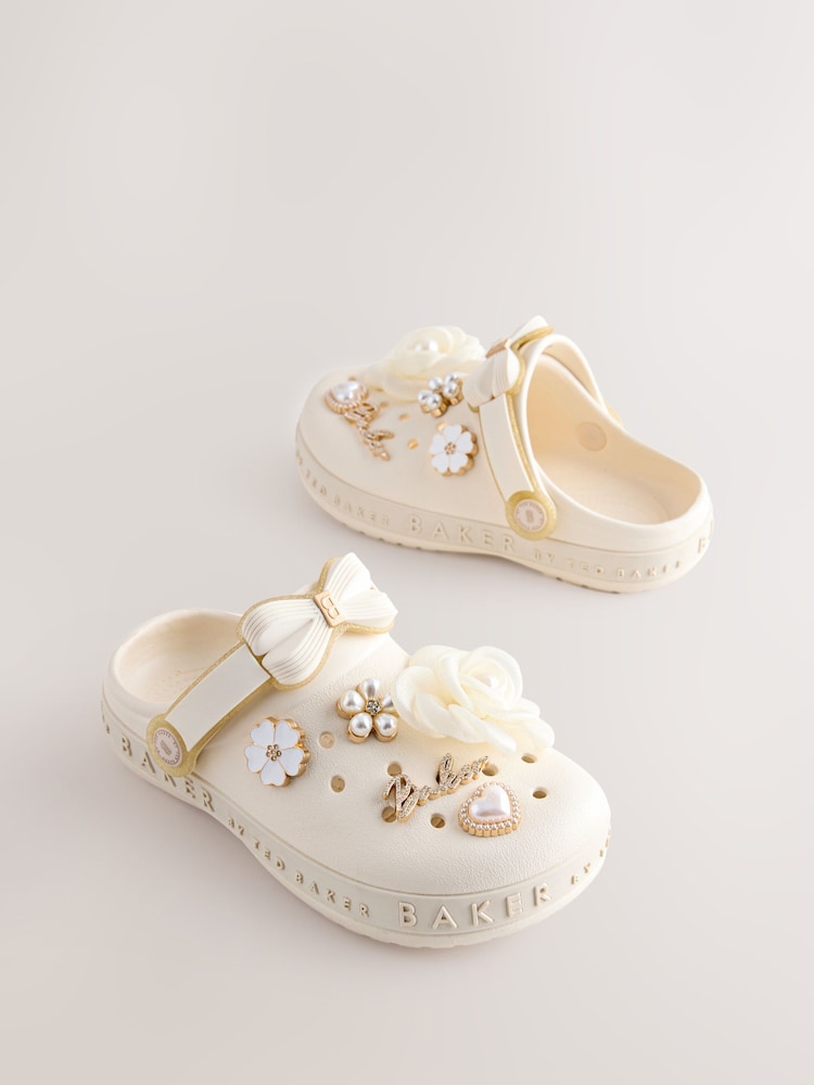 Baker by Ted Baker Ivory Bow Charm Clog Sandals - Image 1 of 4 Baker by Ted Baker Ivory Bow Charm Clog Sandals - Image 1 of 4