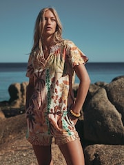 Pink Palm Print Short Sleeve Notch Neck Shirred Bubblehem Top - Image 1 of 8