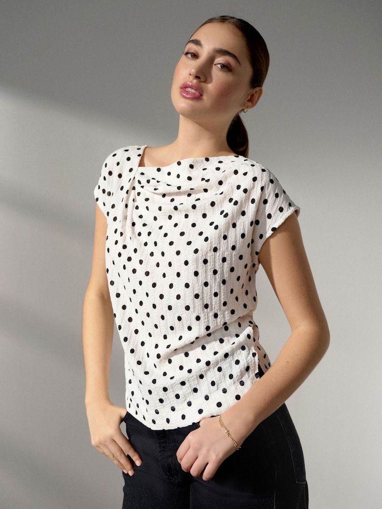 Black/Ecru Polka Dot Asymmetric Pleated Drape Short Sleeve Top - Image 1 of 4