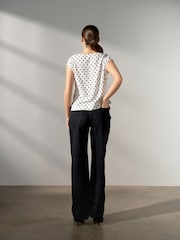 Black/Ecru Polka Dot Asymmetric Pleated Drape Short Sleeve Top - Image 3 of 4