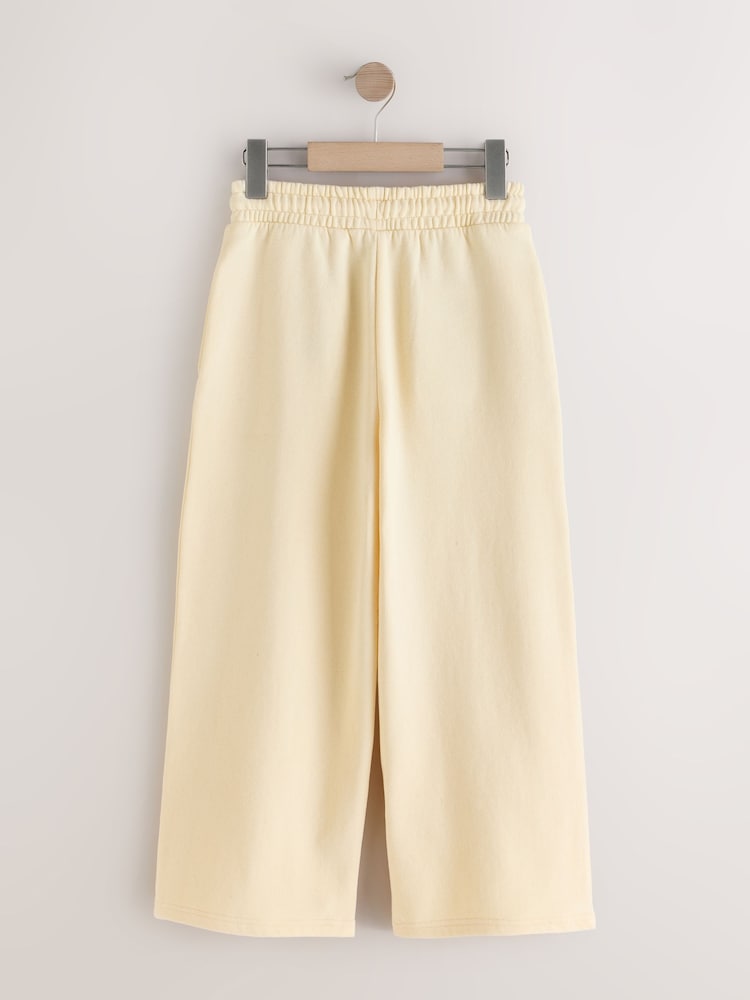 أصفر زبدة - بنطلون رياضي برجل واسعة (3 -16 سنة) - صورة 2 من 4 أصفر زبدة - بنطلون رياضي برجل واسعة (3 -16 سنة) - صورة 2 من 4