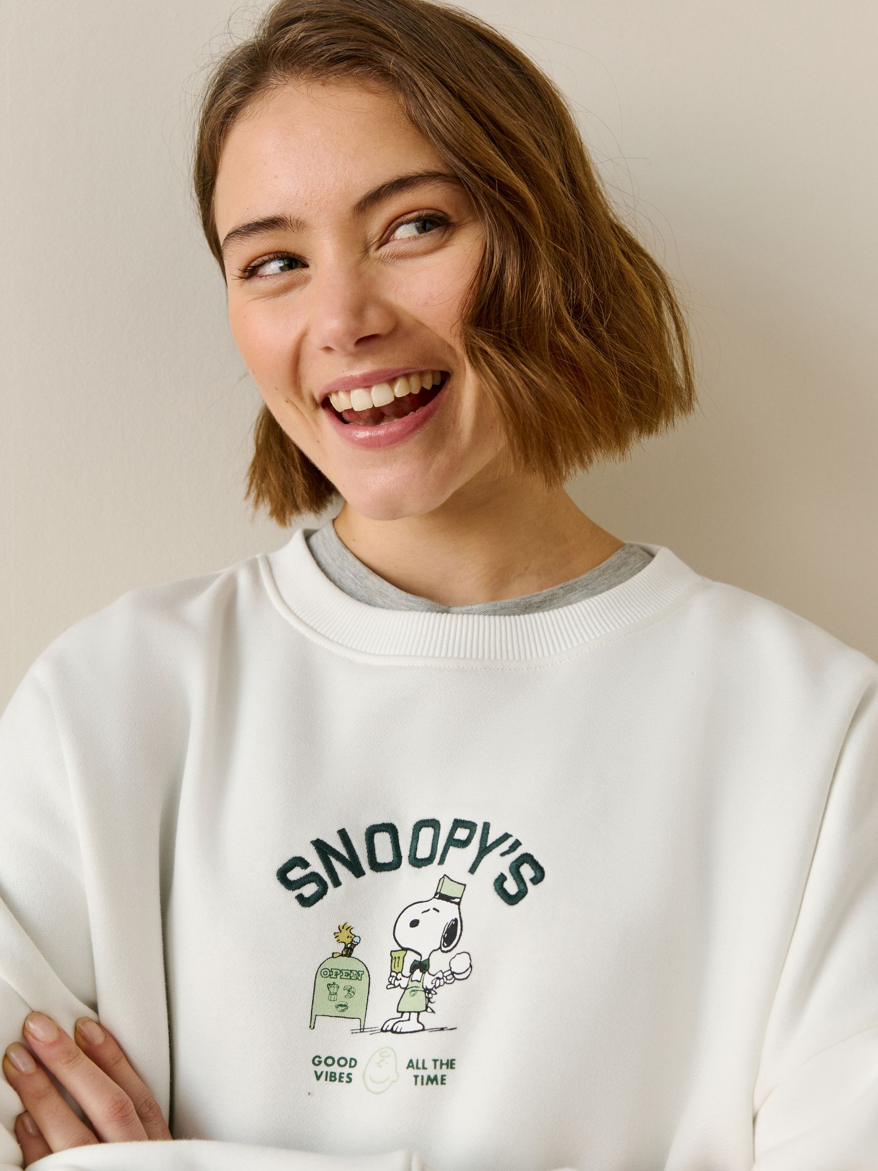 Buy Ecru Snoopy Coffee Shop Graphic Long Sleeve Sweat Top from
