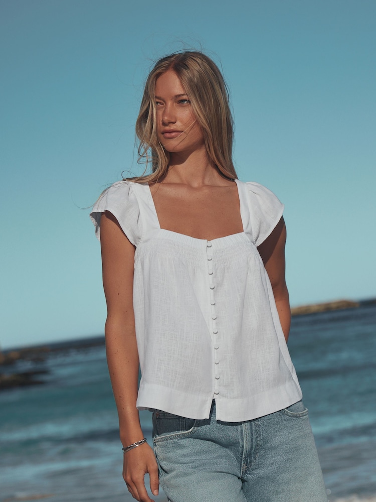 White Flutter Sleeve Button Front Top With Linen - Image 1 of 7 White Flutter Sleeve Button Front Top With Linen - Image 1 of 7