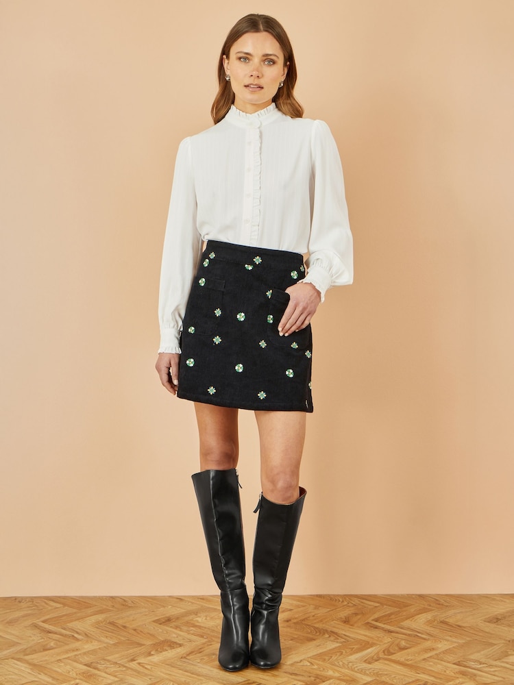 Yumi Black Flower Print Embroidered Cord Mini Skirt - Image 1 of 3 Yumi Black Flower Print Embroidered Cord Mini Skirt - Image 1 of 3