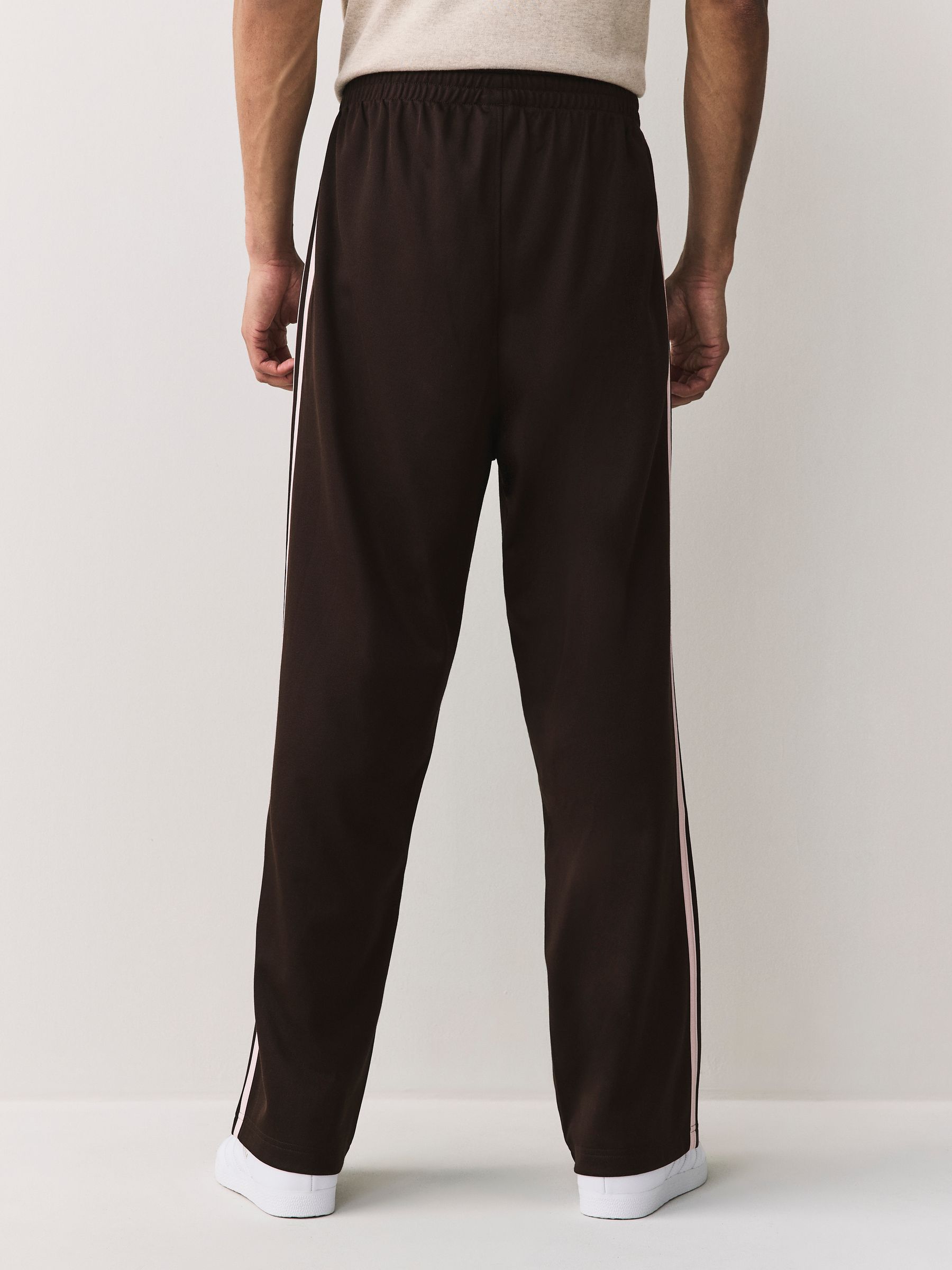 Buy adidas Originals Brown Baggy Track Joggers from Next USA