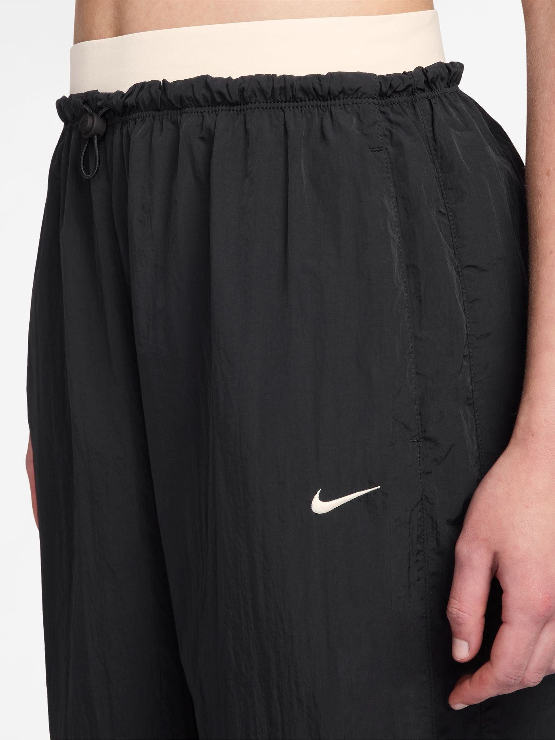 Buy Nike Black Adjustable Parachute Trousers from the Next UK