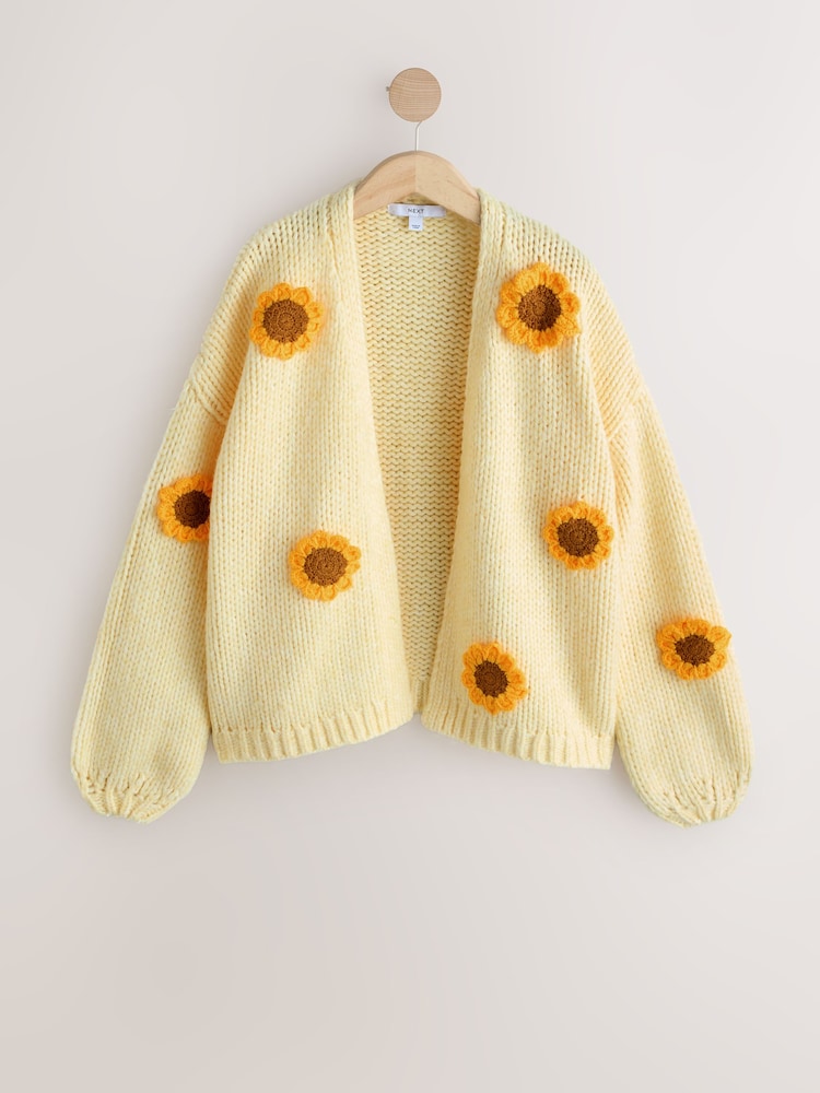 Yellow 3D Sunflower Soft Touch Chunky Knit Cardigan - Image 1 of 3 Yellow 3D Sunflower Soft Touch Chunky Knit Cardigan - Image 1 of 3